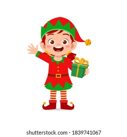 happy cute little kid boy and girl wearing green elf christmas costume