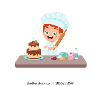 happy cute little kid boy and girl wear chef uniform and cooking a birthday cake