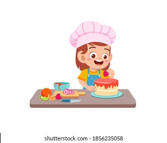 happy cute little kid boy and girl wear chef uniform and cooking a birthday cake