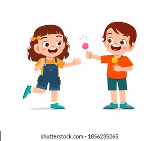 Happy Cute Little Kid Boy And Girl Sharing Food To Friend