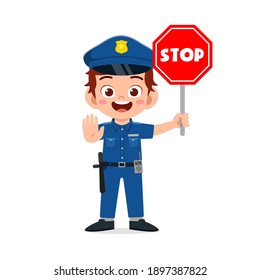 happy cute little kid boy wearing police uniform and holding stop sign