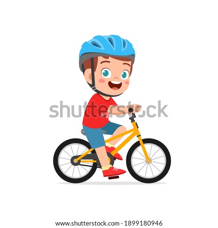 happy cute little kid boy riding bicycle