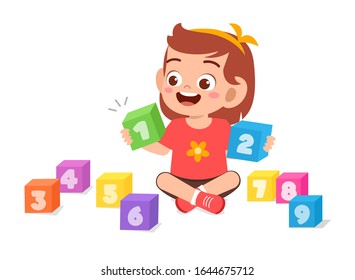 happy cute little kid girl play with block number