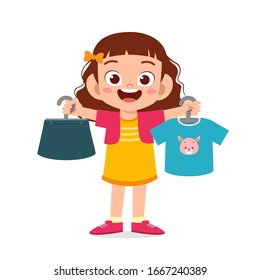 happy cute little kid girl choose clothes