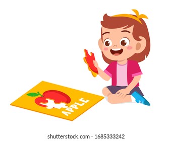 happy cute little kid girl play jigsaw puzzle