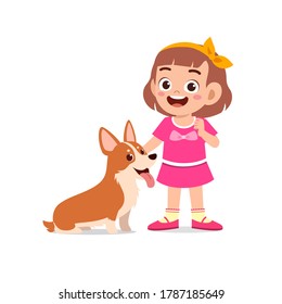 happy cute little kid play with dog