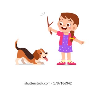 happy cute little kid play with dog