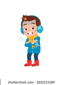 happy cute little kid play and wear jacket in winter season. child feeling chill wearing warm clothes