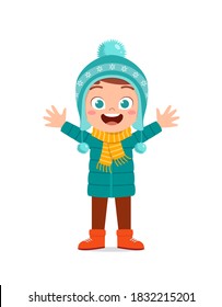 happy cute little kid play and wear jacket in winter season. child smile wearing warm clothes