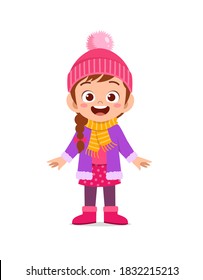 happy cute little kid play and wear jacket in winter season. child smile wearing warm clothes