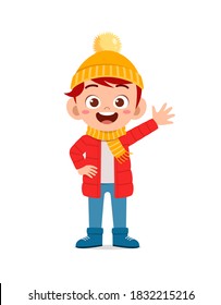 happy cute little kid play and wear jacket in winter season. child smile wearing warm clothes