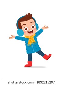 happy cute little kid play and wear jacket in winter season. child smile wearing warm clothes