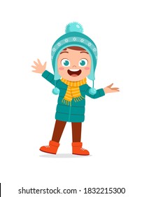 happy cute little kid play and wear jacket in winter season. child smile wearing warm clothes