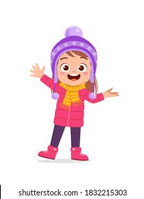 happy cute little kid play and wear jacket in winter season. child smile wearing warm clothes