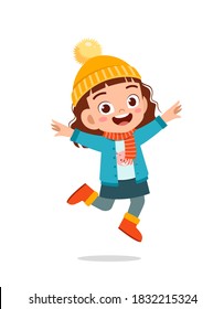 happy cute little kid play and wear jacket in winter season. child smile wearing warm clothes