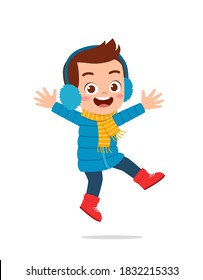 happy cute little kid play and wear jacket in winter season. child smile wearing warm clothes