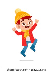 happy cute little kid play and wear jacket in winter season. child smile wearing warm clothes