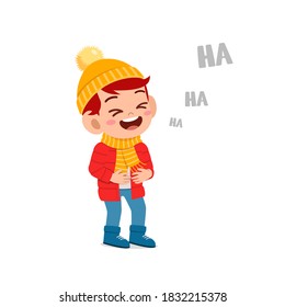 happy cute little kid play and wear jacket in winter season. child laugh wearing warm clothes