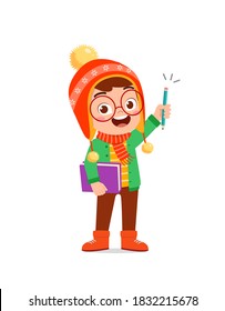 happy cute little kid study and wear jacket in winter season. child read book wearing warm clothes