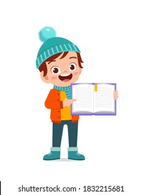 happy cute little kid study and wear jacket in winter season. child read book wearing warm clothes