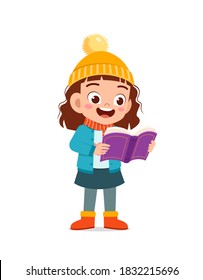 happy cute little kid study and wear jacket in winter season. child read book wearing warm clothes