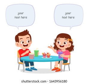 happy cute little kids boy and girl lunch together