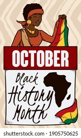 Happy dark skinned woman holding a flag with African colors and calendar decorated with Africa map, reminding at you to celebrate Black History Month on October.