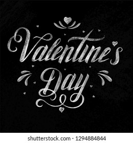 Happy Valentine’s day - hand drawn inscription on a chalk board. Lettering. Greeting card. Poster for Valentine's Day with hearts