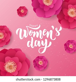 Happy Woman’s Day hand lettering text with beautiful flowers. Vector illustration. 8 March greeting calligraphy design. Template for a poster, cards, banner.