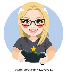 Happy delighted blonde gamer girl with glasses playing video games