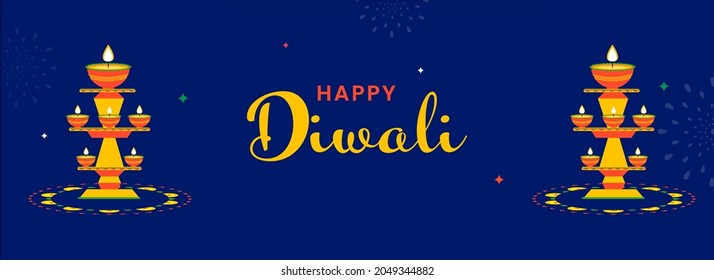 Happy Diwali Celebration Concept With Lit Oil Lamps (Diya) Stands On Blue Background.