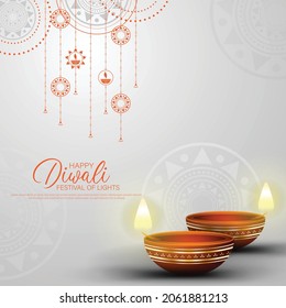 Happy Diwali - festival of lights colorful background with decorative diya lamp and rangoli.