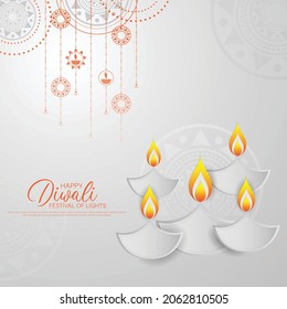 Happy Diwali - festival of lights colorful background with decorative diya lamp and rangoli.
