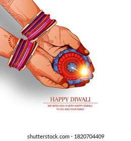 Happy Diwali Festival , Festival of lights ,Hand holding Indian oil lamp