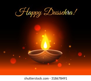 Happy Dussehra shining typographical background with candles, fire and blurred bokeh lights. 
