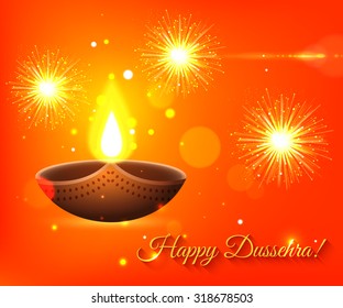 Happy Dussehra shining typographical background with candles, fire and blurred bokeh lights.