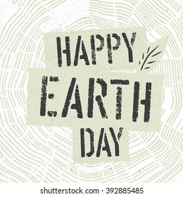 Happy Earth Day Logotype on Tree Rings Background. Template for Celebrating card
