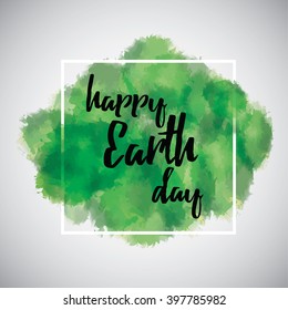 Happy Earth Day sign on the green watercolor background with a frame. Handwriting on the paint