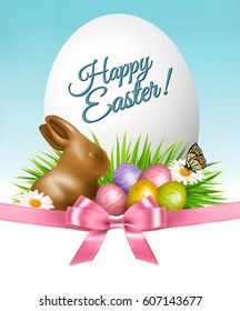 Happy Easter background. Colorful eggs and chocolate bunny on green grass. Vector.