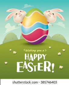Happy Easter! Easter bunnies and egg in field. Wide copy space for text.