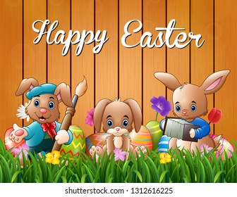 Happy easter bunnies on a background fence
