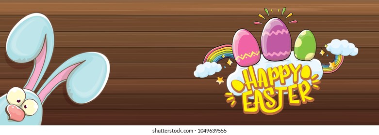 happy easter bunny with calligraphic text, clouds , rainbow and color easter eggs isolated on wood horizontal banner background. vector easter greeting card with blue rabbits ears. Design elements set