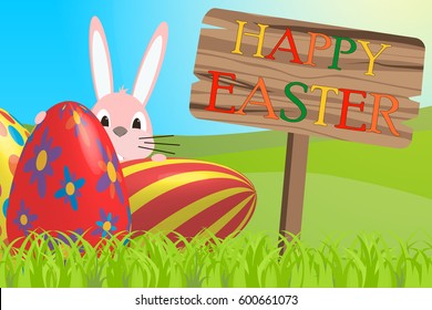 Happy Easter. Easter bunny and eggs in field