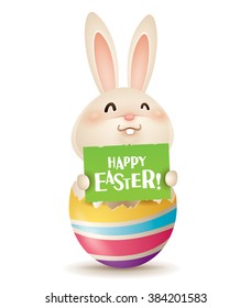 Happy Easter! Easter bunny inside a cracked easter egg.

