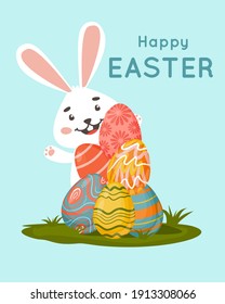 
Happy Easter. Easter bunny with painted eggs in the meadow. For postcards, banners, flares, leaflets.