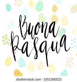 Happy Easter Buona Pasqua in Italian hand written brush lettering with decorated eggs on white background.