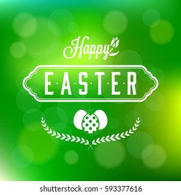Happy easter calligraphic headline and eggs, wreath on green bokeh background