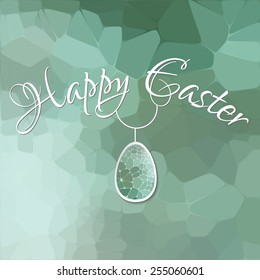 Happy Easter card with 3d geometric egg on green blurred background.