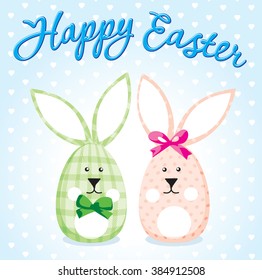 Happy easter card with couple of cute handmade toy rabbits, blurred background and nice calligraphy font.