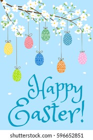 Happy Easter card with eggs on blooming spring tree